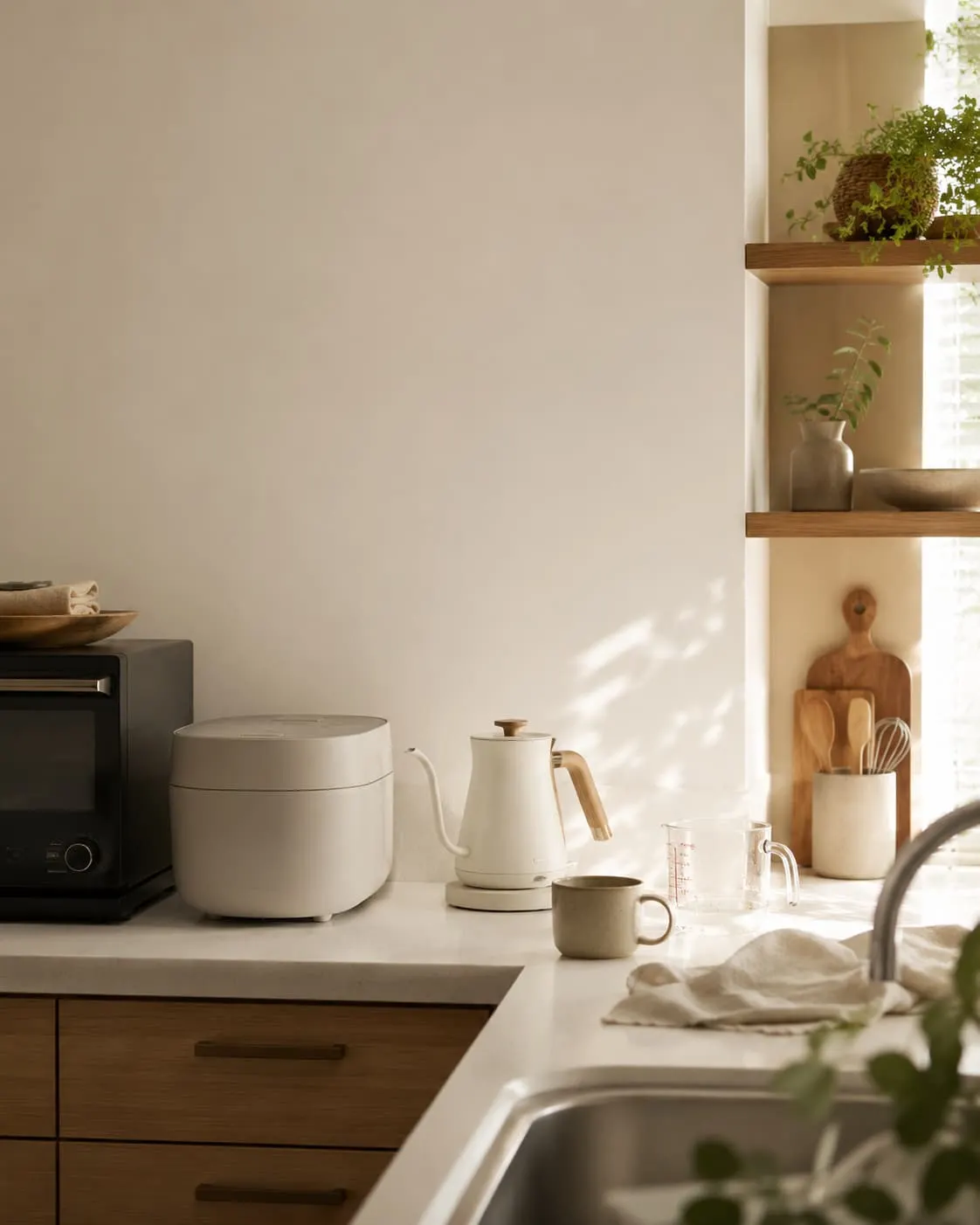 Cast iron and enamelled cookware in a quiet kitchen